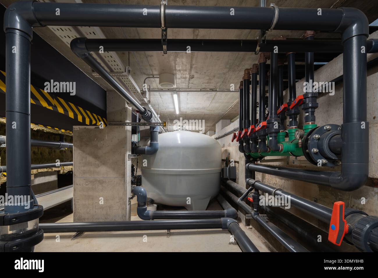 Industrial HVAC system showcasing complex ductwork and piping. This ...