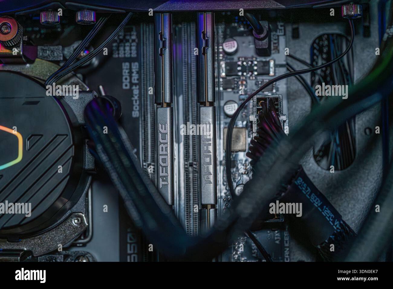 Gaming motherboard with DDR5 RAM memory modules and RGB liquid cooling ...
