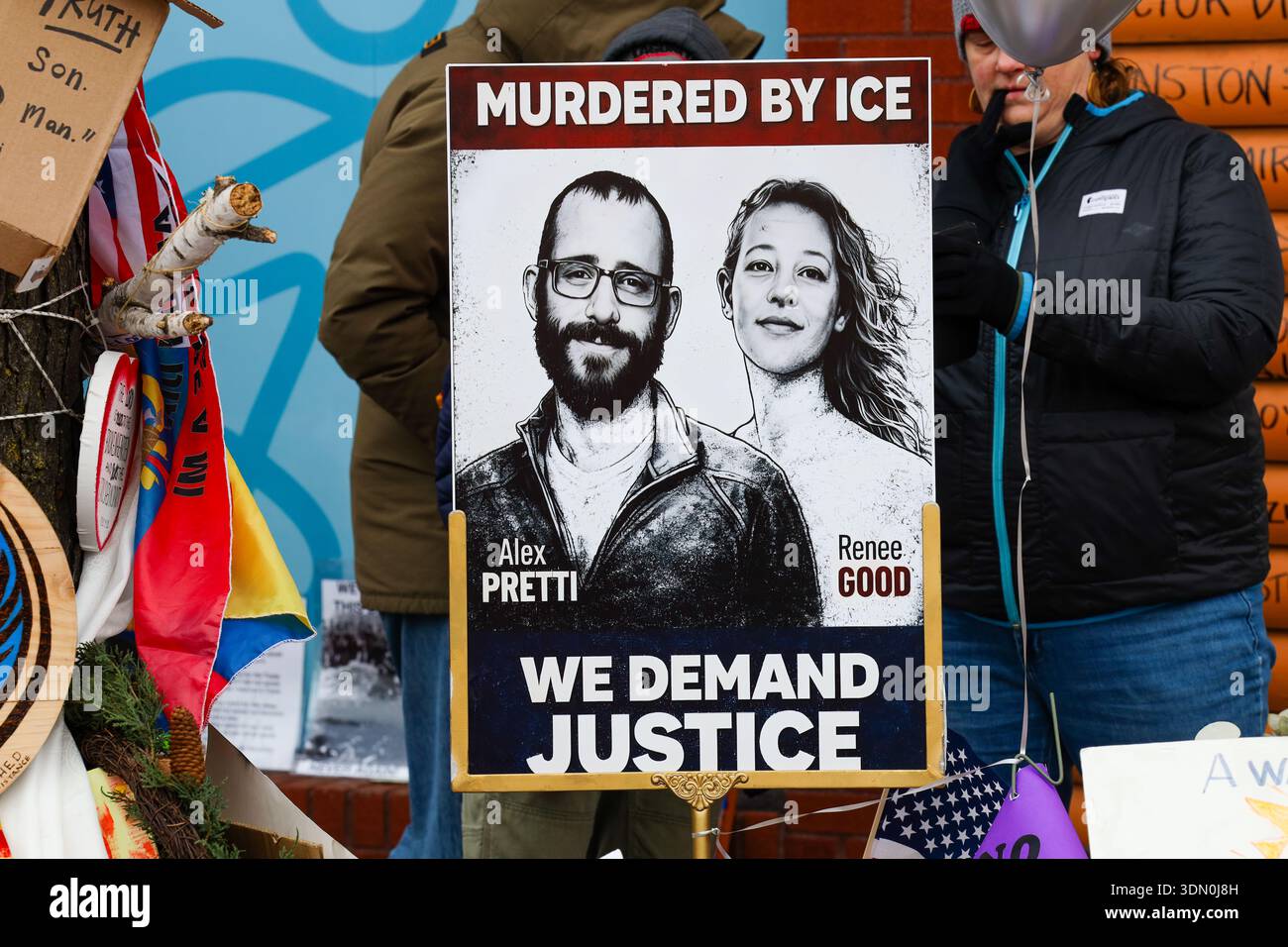 A sign displaying portraits of Alex Pretti and Renee Good at the Alex ...