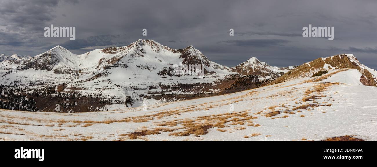 This scenic autumn mountain panorama features Scarp Ridge and the Ruby Range, including 13er Mount Owen, located near Crested Butte, Colorado. Stock Photo