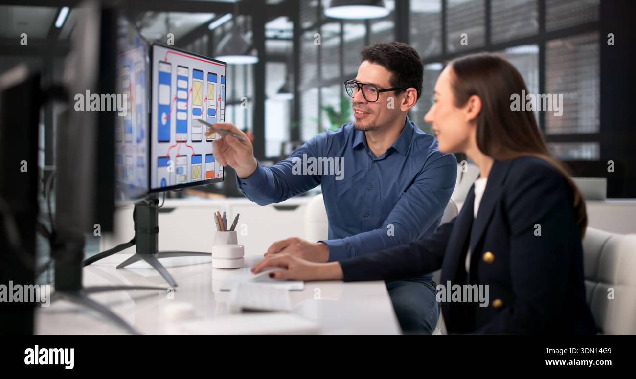 Design Team Using Computers For UI/UX Development In Webinar Training. Stock Photo