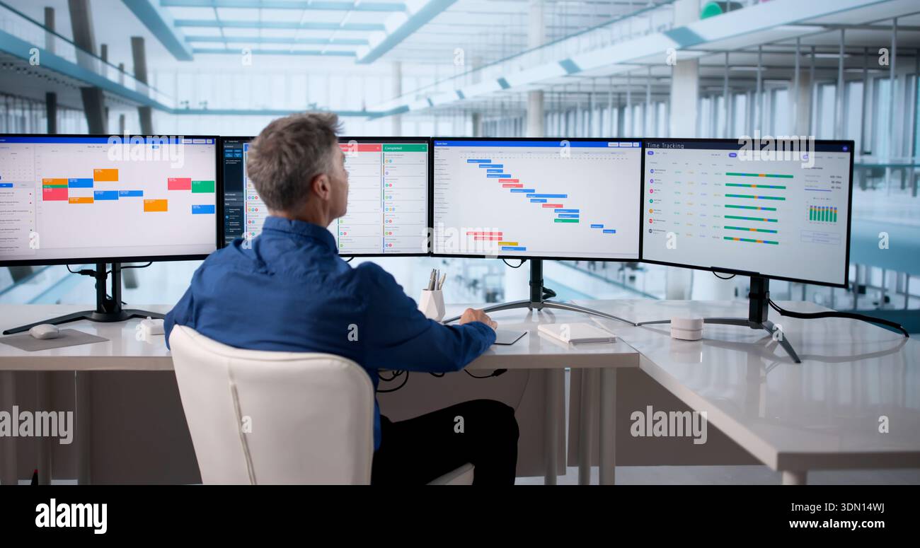 Businessman Using Scheduling Software To Manage Events And Reports Efficiently. Stock Photo