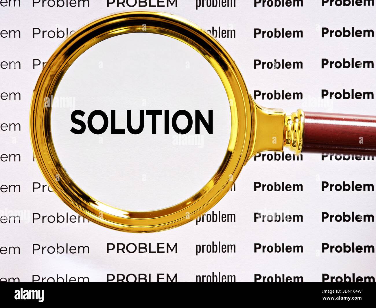 Problem solving, finding answers, searching for a solution. Magnifying glass highlighting the word SOLUTION among many PROBLEM words, Stock Photo