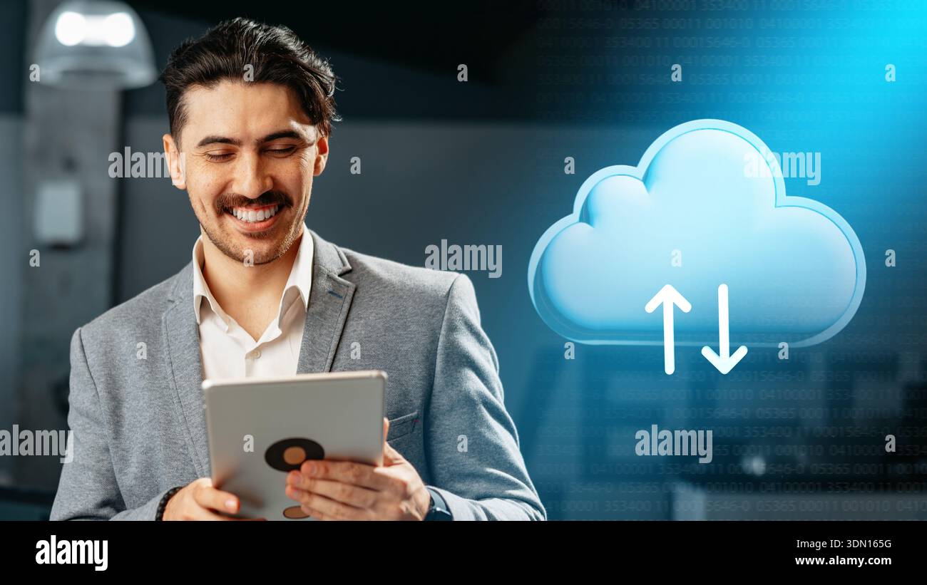 Man using tablet to manage data storage in cloud computing environment at modern office Stock Photo
