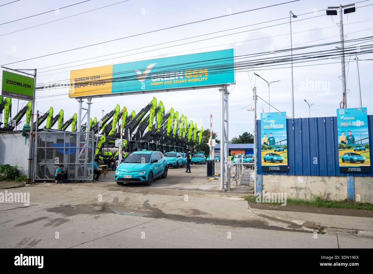 Entrance to Green GSM electric taxi depot in Cebu showing fleet of ...