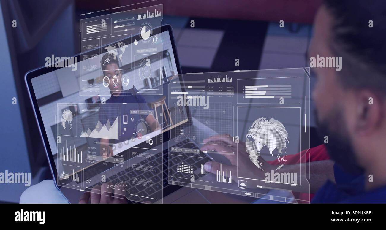 Working bearded man in blue top using laptop at home office, showing woman and virtual globe Stock Photo