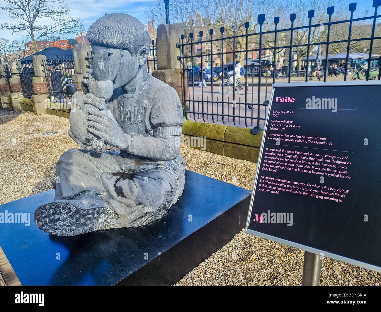 Amsterdam, Netherlands - Feb 7, 2026: Sculpture “Bunny Boy Black” by Faile in Amsterdam. - Smartphone Captured Stock Image