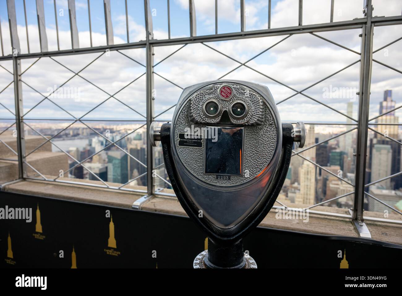 coin-operated binocular viewer, also commonly known as a telescope viewer or scenic viewer, with the New York City skyline in the background. Stock Photo
