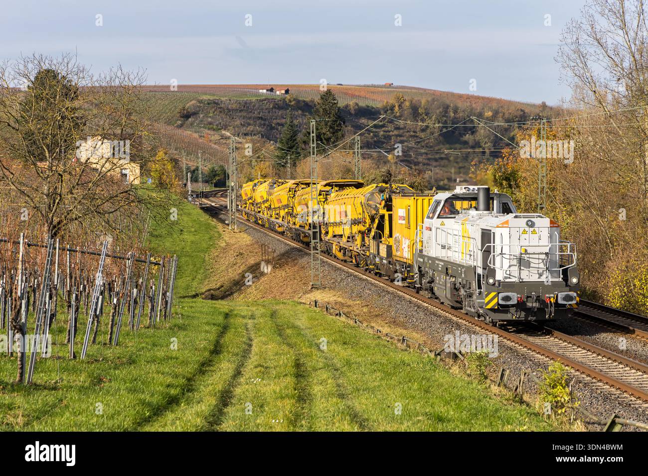 Lauffen am Neckar, Germany - November 13, 2025: Train with material transport units for track construction by Schweerbau on Frankenbahn railway line i Stock Photo