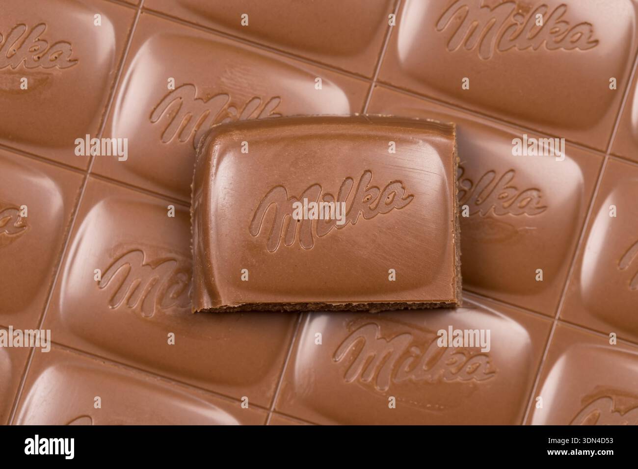 Stuttgart, Germany - September 18, 2025: Milka chocolate bar Alpine milk close-up with company logo in Stuttgart, Germany. Stock Photo