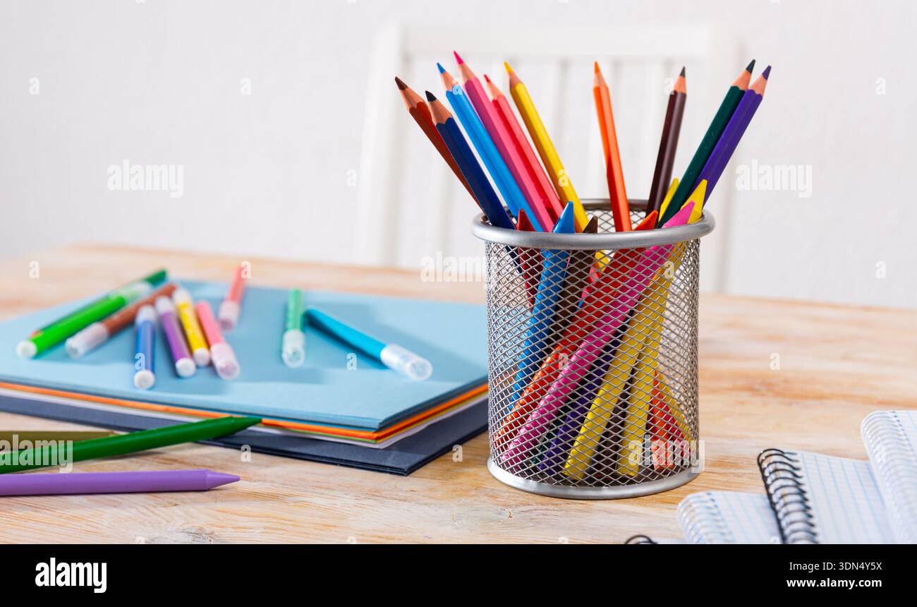 Concept of preparation for school. Different school supplies on the table Stock Photo