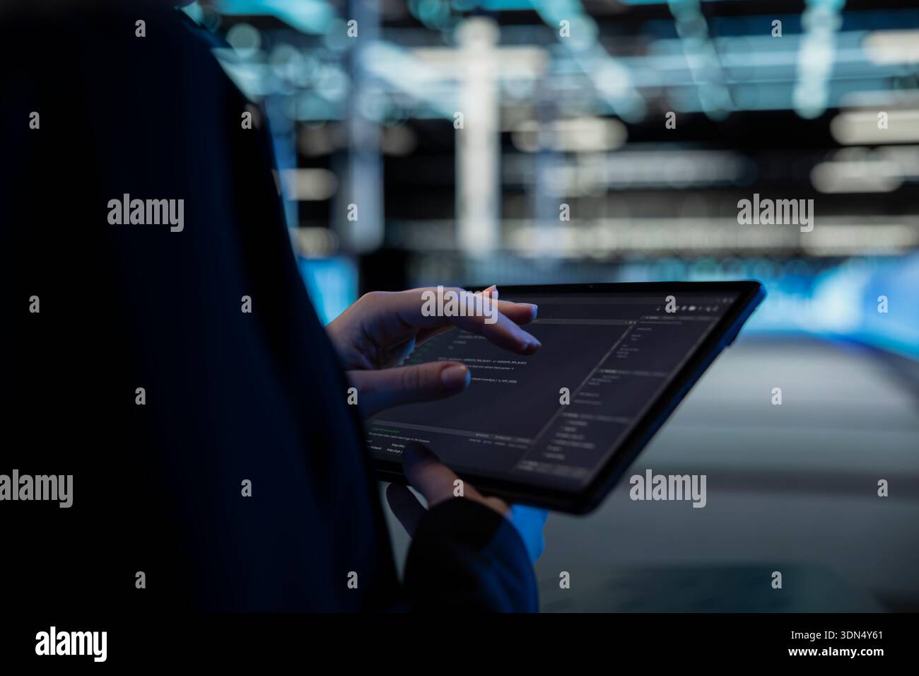 Close up of tablet used by data center computer scientist to write code, updating infrastructure network systems. Server hub worker typing on touchscreen device, coding upgrades Stock Photo