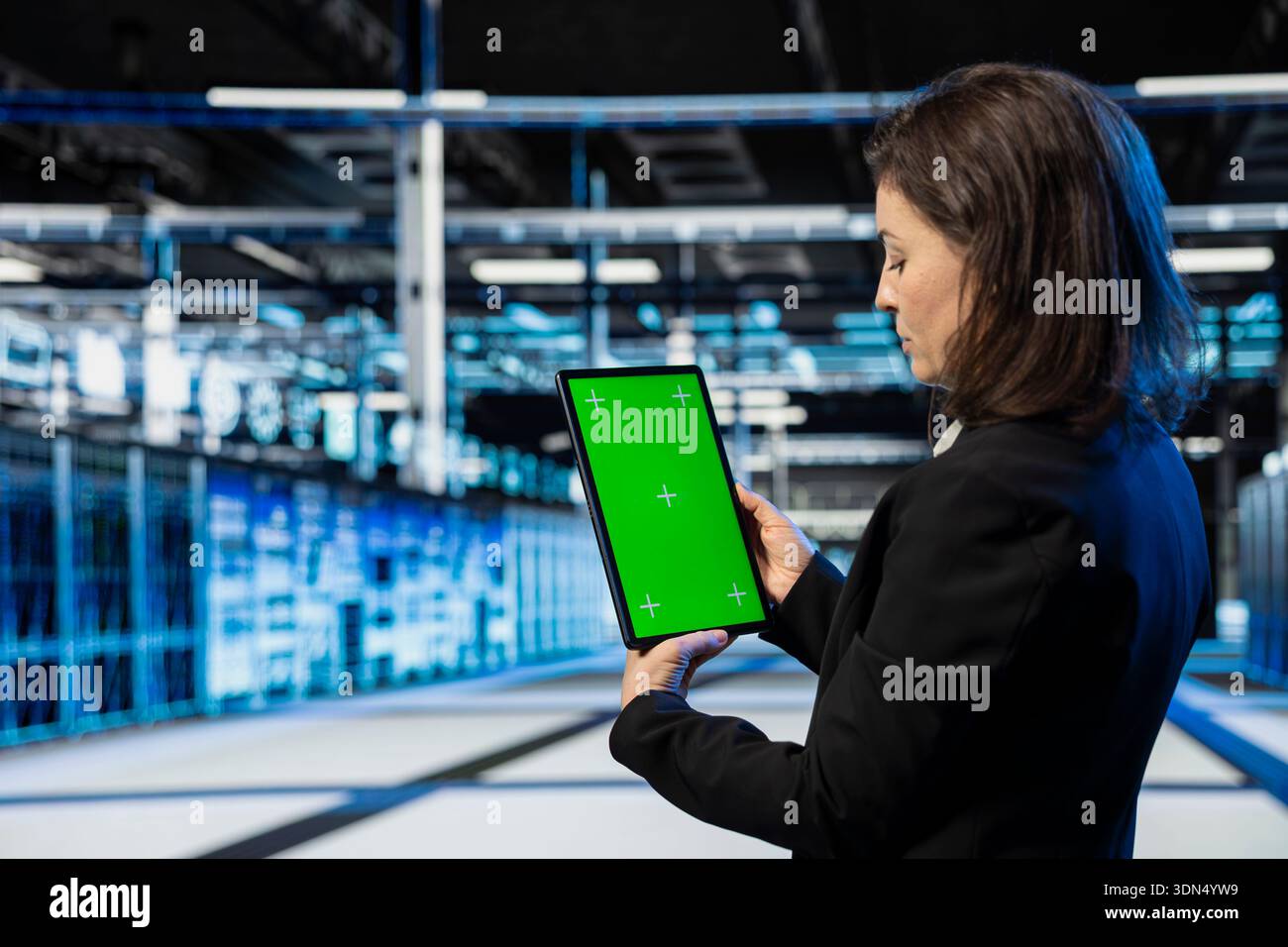 Green screen mockup tablet used by data center admin to do checkup on cloud computing infrastructure, AR overlay. Server hub computer scientist using chroma key isolated screen device Stock Photo