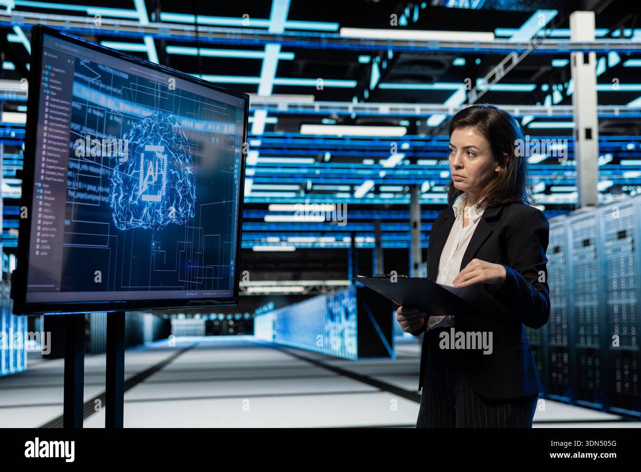 Data center computer scientist using AI to troubleshoot backend operations gear. Server hub worker running deep learning software development program on large display, resolving system crashes Stock Photo