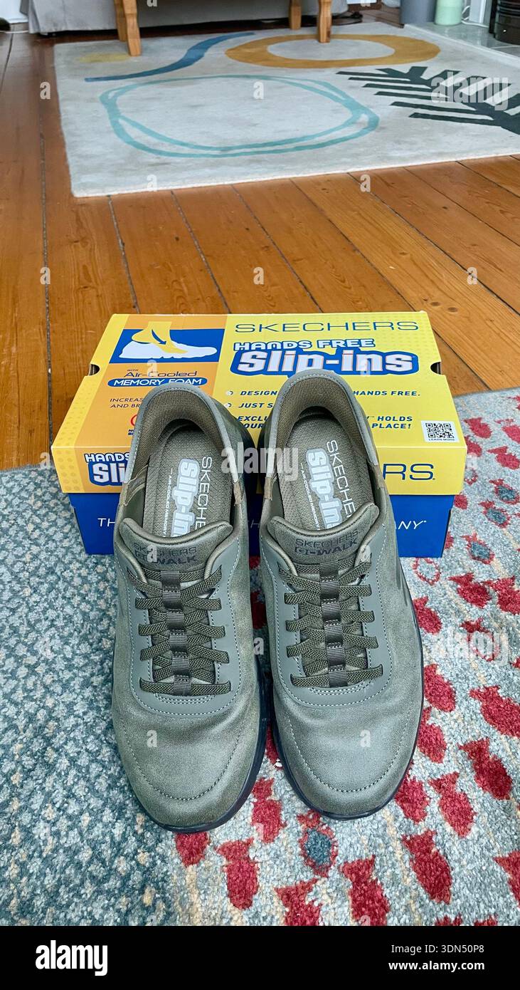 A pair of new Skechers comfort slip-ins for men with shoebox - Smartphone Captured Stock Image