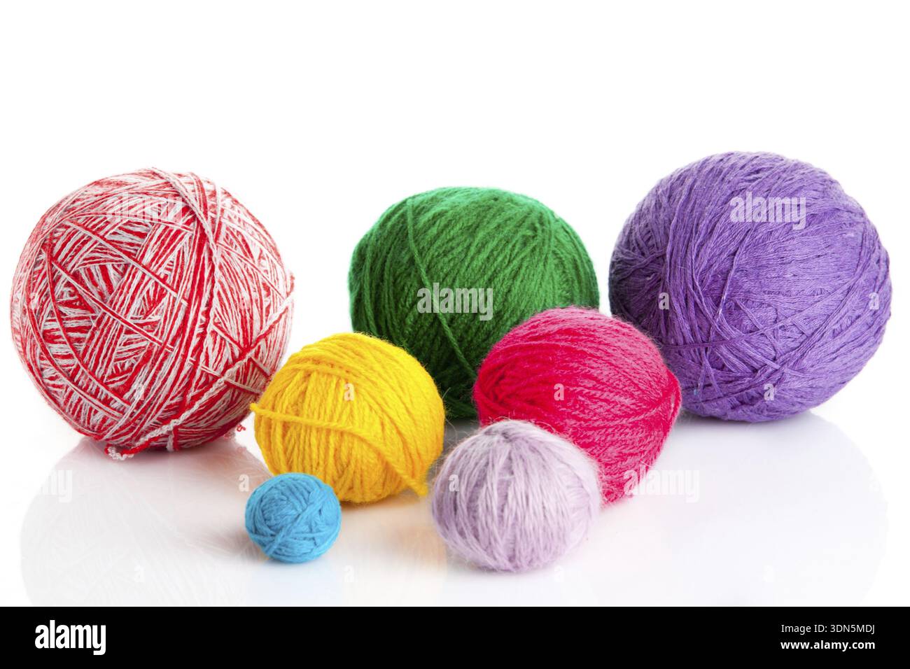 Colorful different thread balls. wool knitting on white background Stock Photo