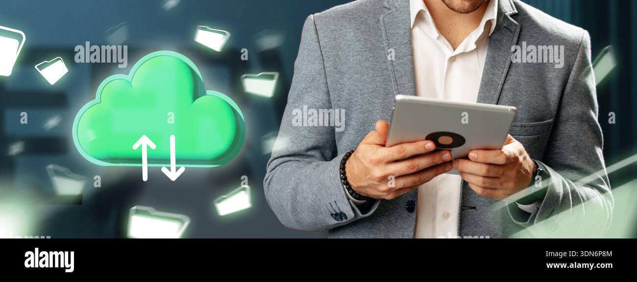 Man holding tablet while using cloud storage service on modern background in office setting Stock Photo