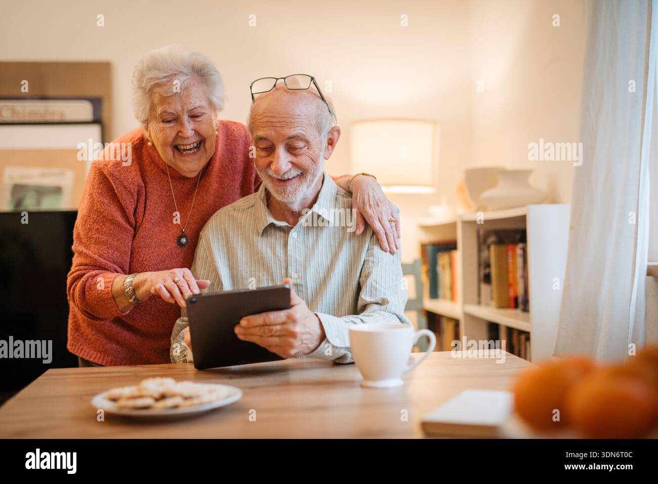 Senior coule working with tablet, having problem with technology. Stock Photo