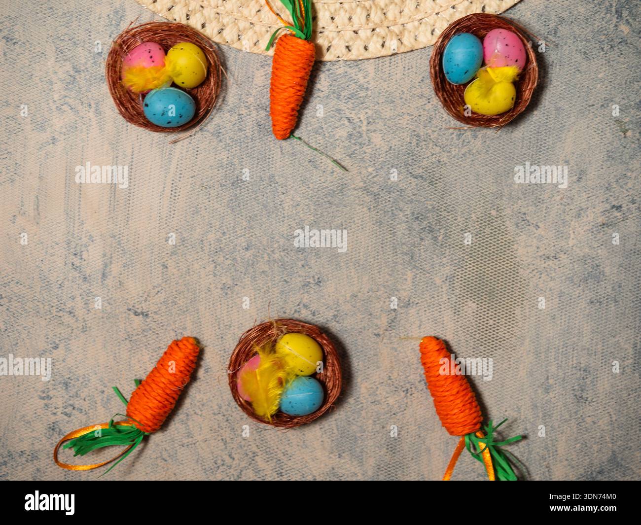 Easter bonnet straw hat decorated with eggs and flowers Stock Photo