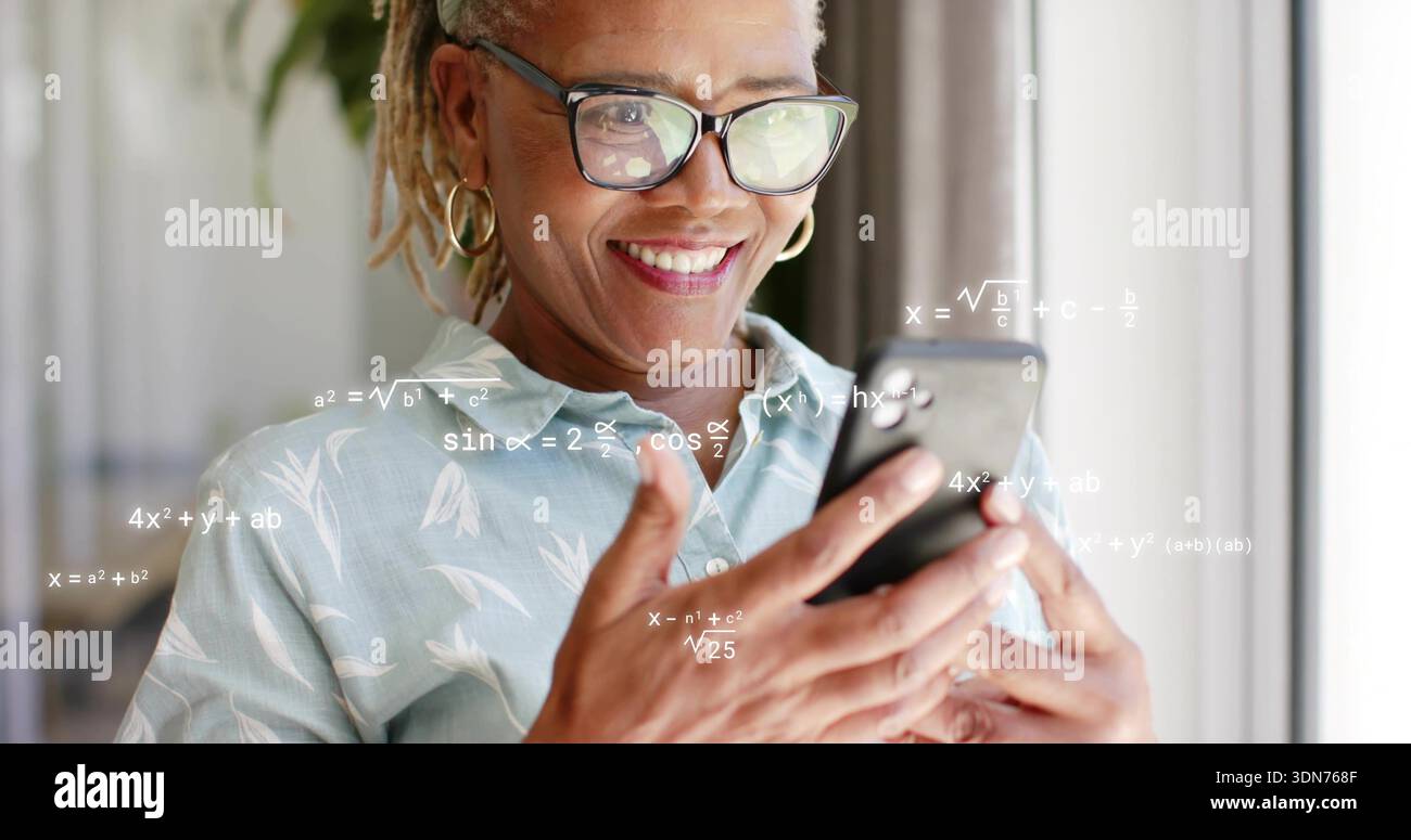 Smiling woman in blue blouse with glasses and hoops holding phone at window, seeing math overlays Stock Photo