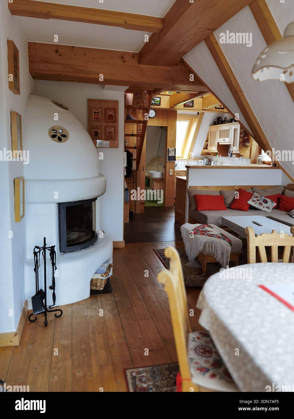 Cozy Rustic Living Room with Fireplace and Wooden Beams - Smartphone Captured Stock Image