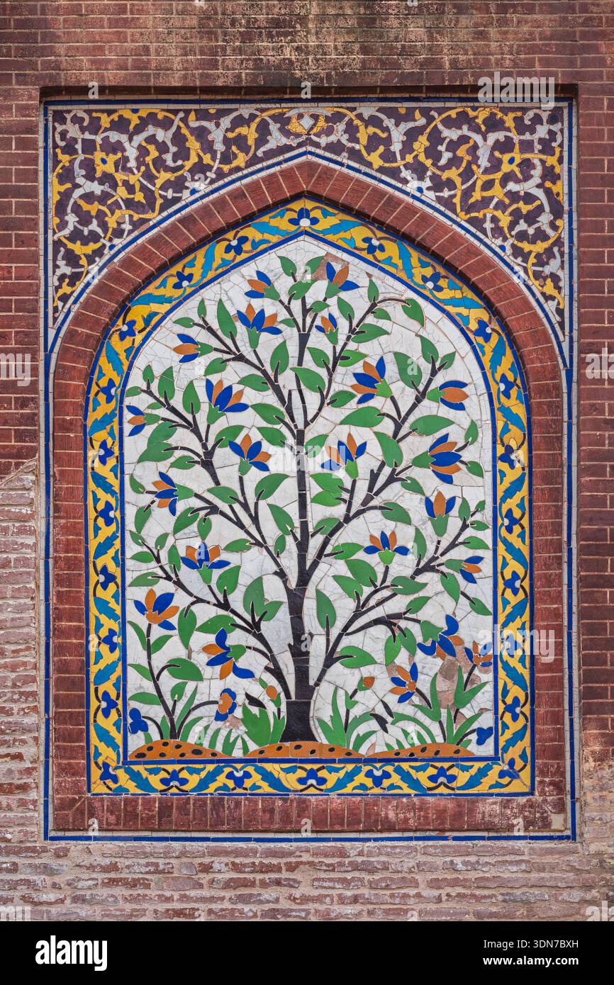 Vertical kashi-kari or faience tile mosaic floral panel with tree on ...