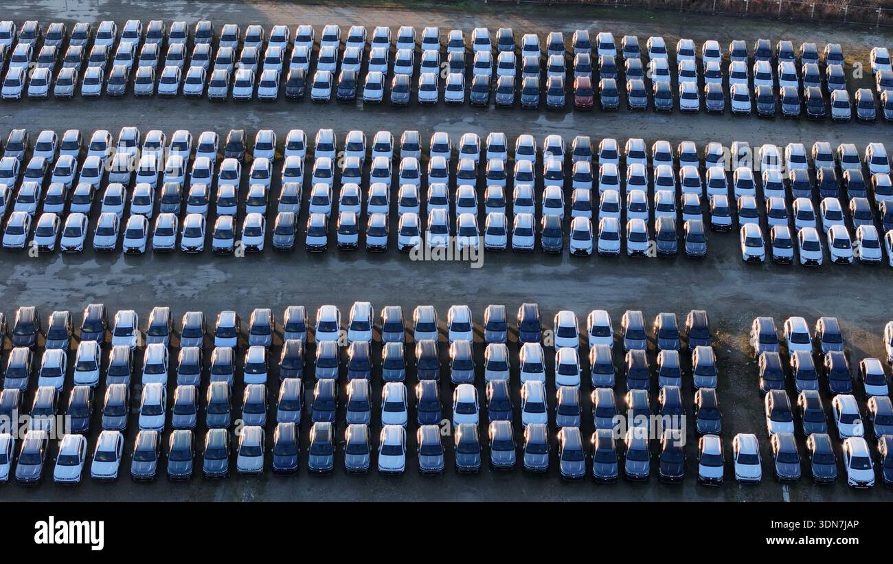 New car inventory organized in rows, a large parking lot Stock Photo ...