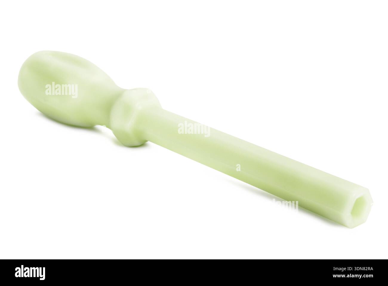 Green plastic universal hex screwdriver lying on white background Stock Photo