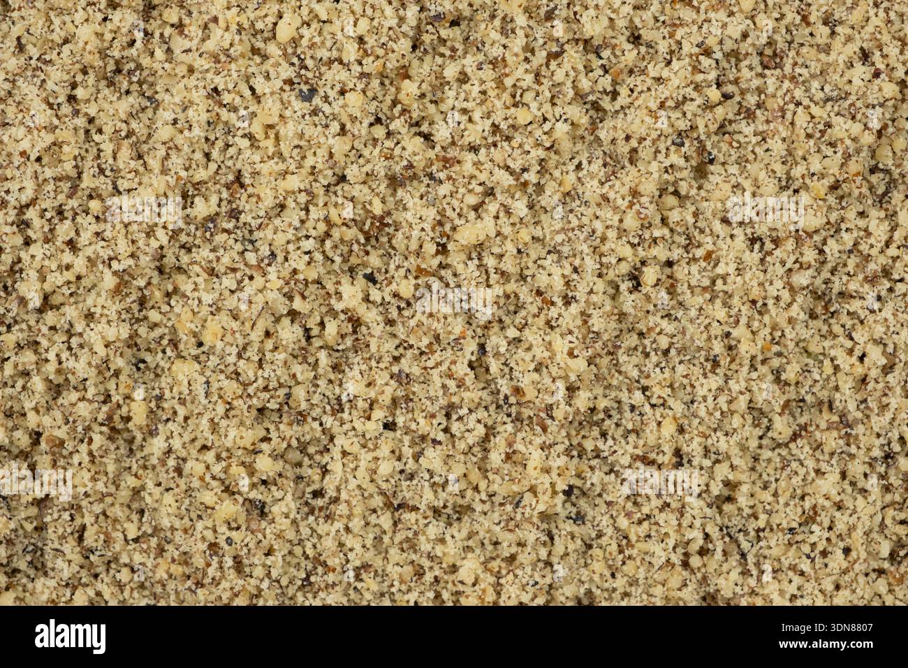 Macro crushed walnut kernels top view. Stock Photo