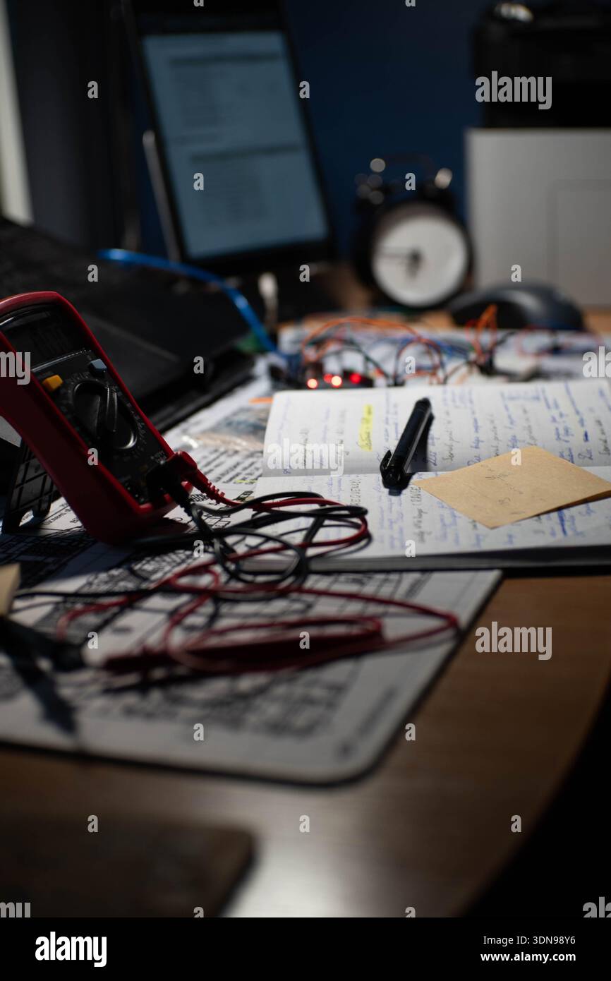 A detailed view of an electronics workbench setup, showing circuit ...