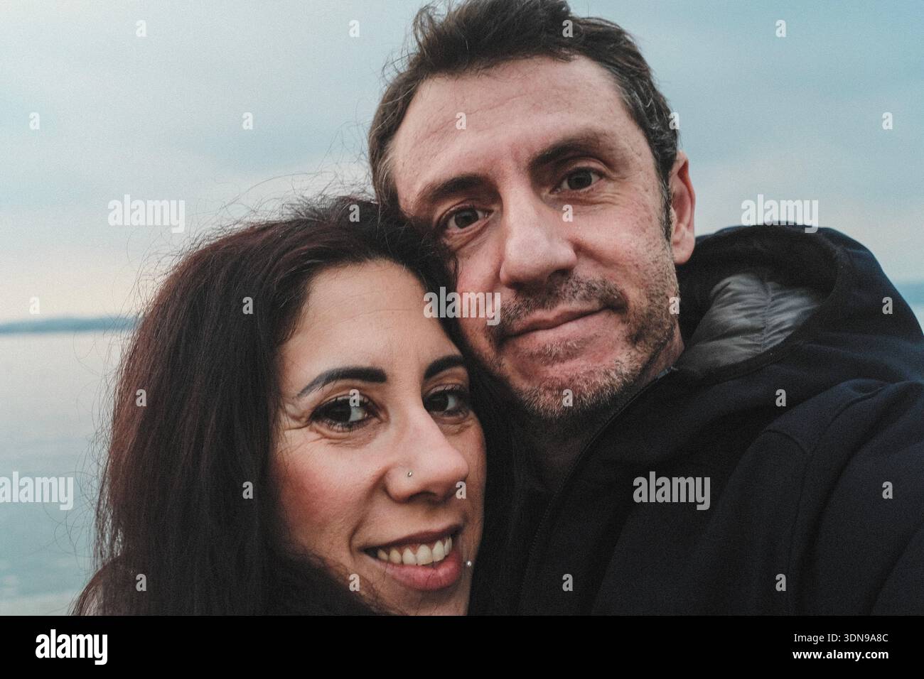 Husband and wife portrayed in close-up shots during an outdoor day Stock Photo