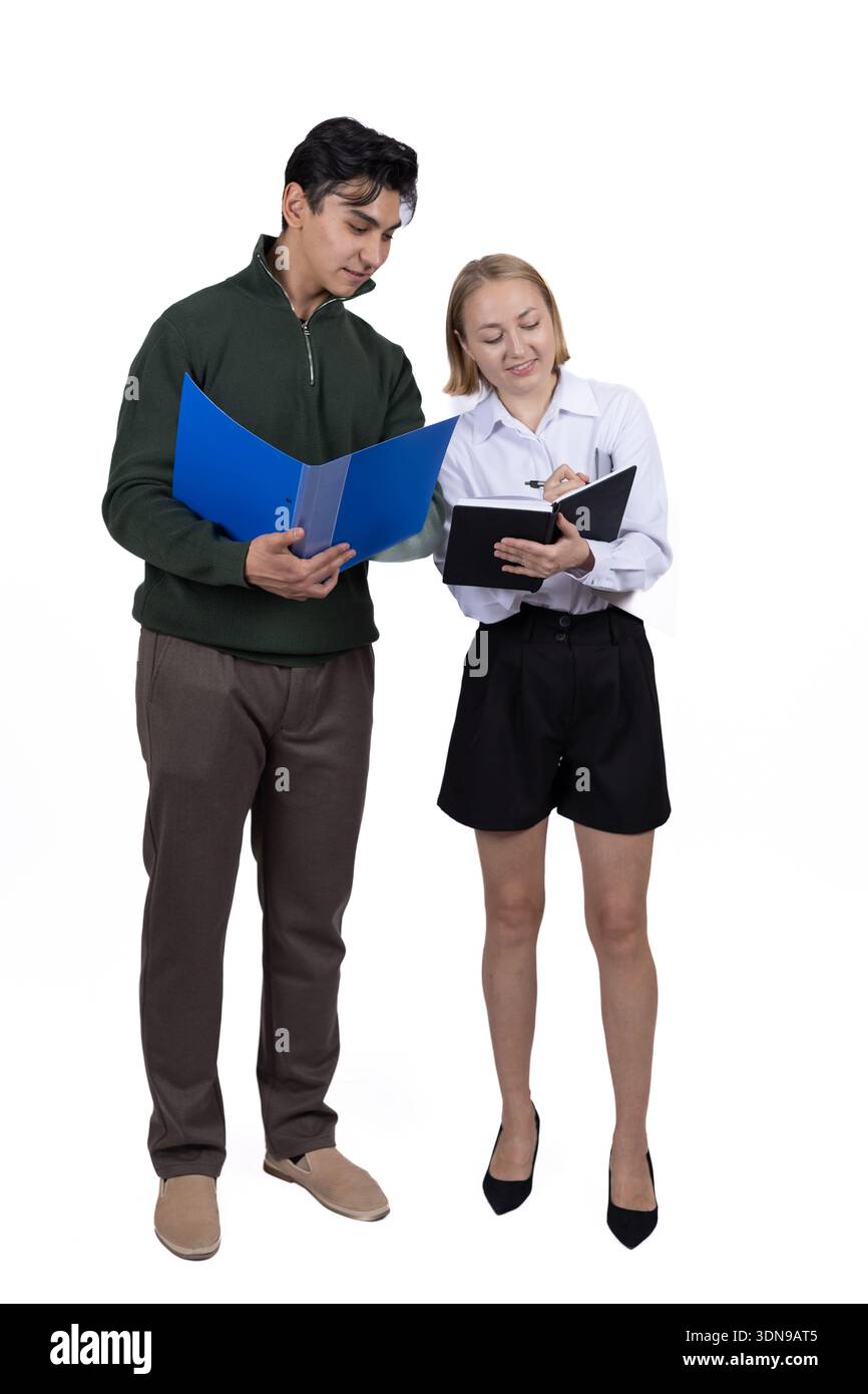 Two students standing with blue folder and talking Stock Photo