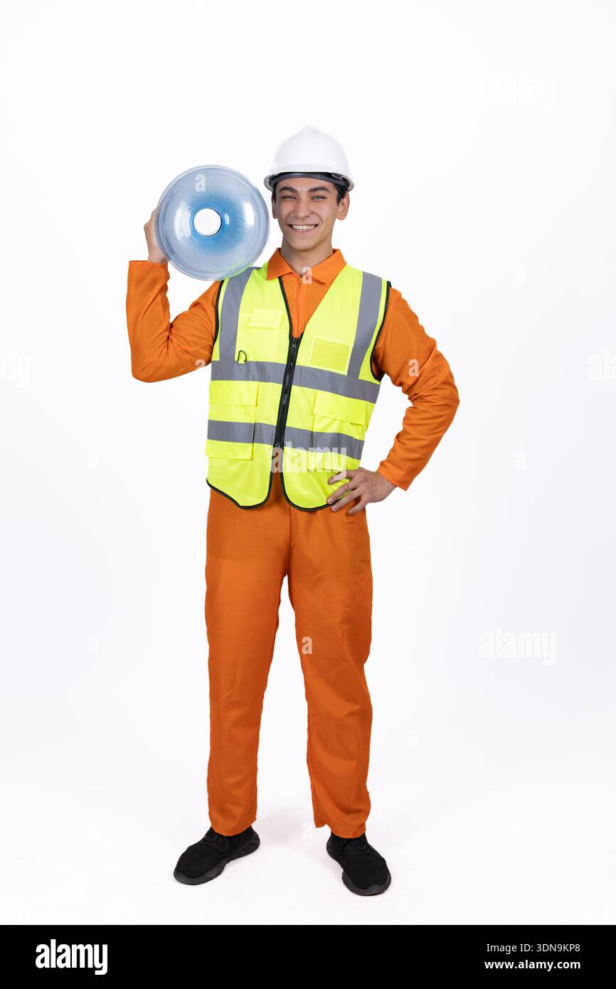 Man in work uniform shouting through a megaphone Stock Photo
