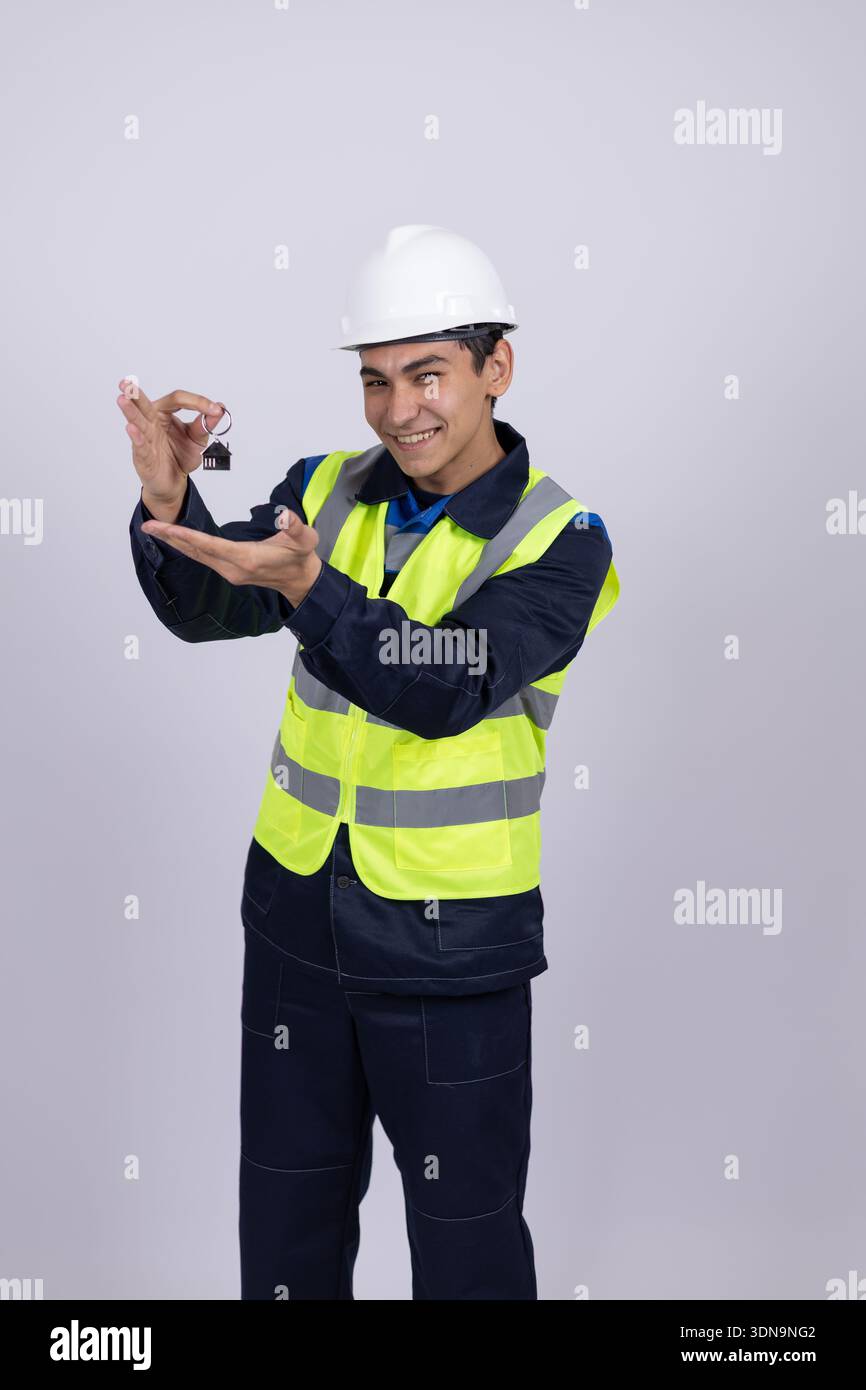 Worker in safety helmet using a digital tablet Stock Photo
