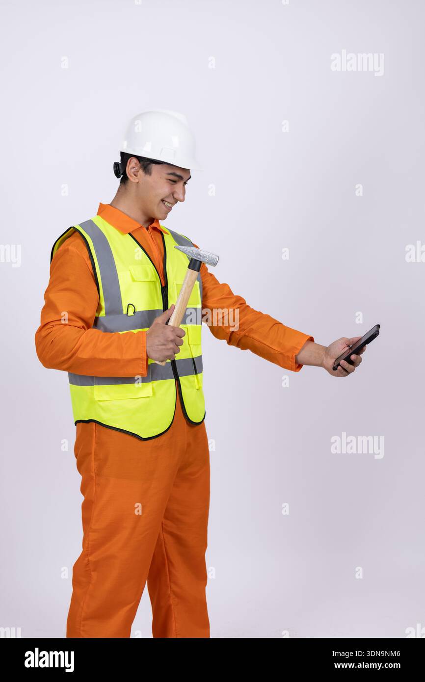 Construction worker using smartphone on white background Stock Photo
