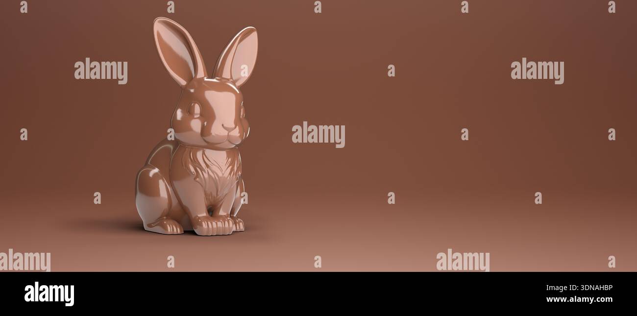 Chocolate Easter bunny on brown background with copy space for text. Stock Photo