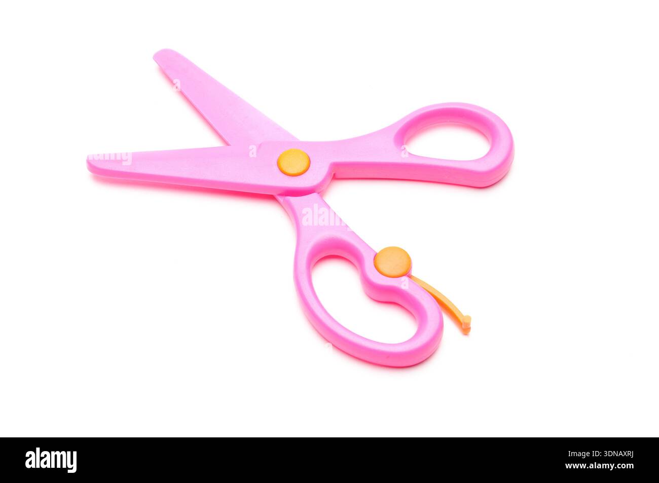 Pink baby scissors on an isolated white background Stock Photo