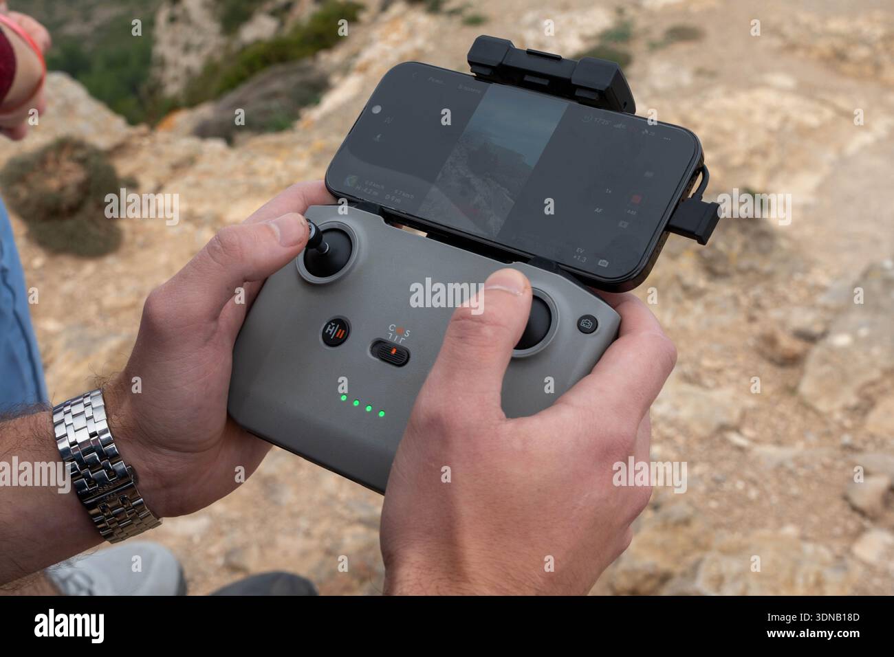 Man holding drone controller outdoors Stock Photo