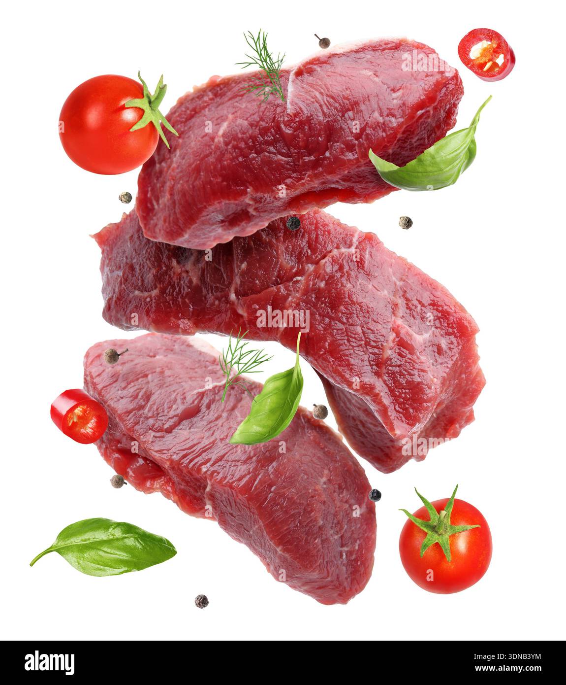 Fresh beef steaks falling on white background Stock Photo