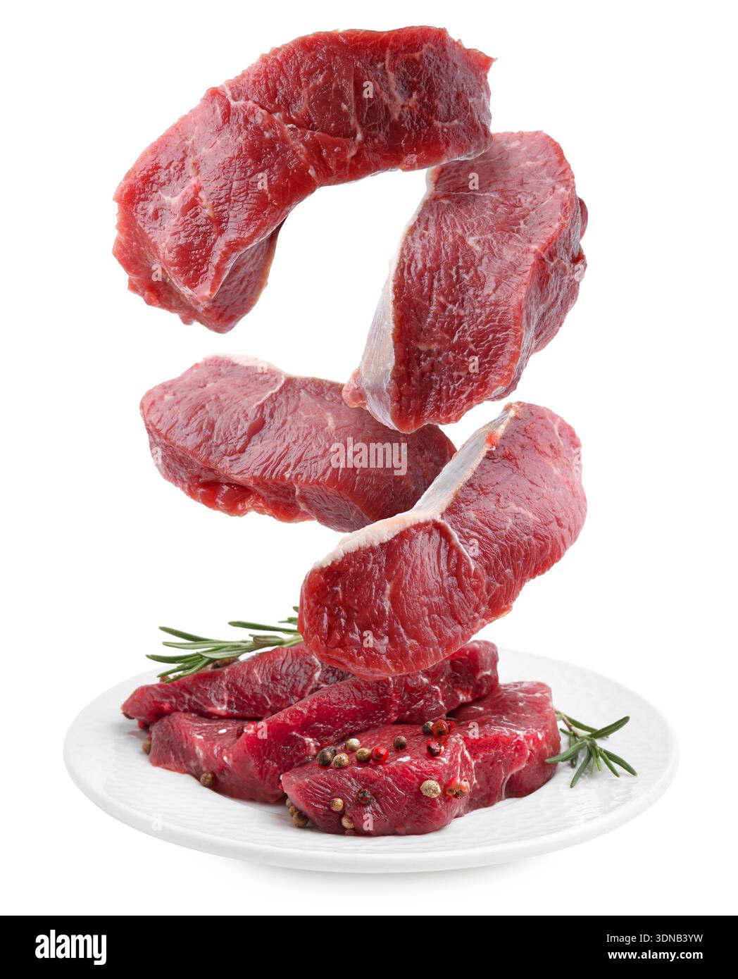 Fresh beef steaks falling on white background Stock Photo