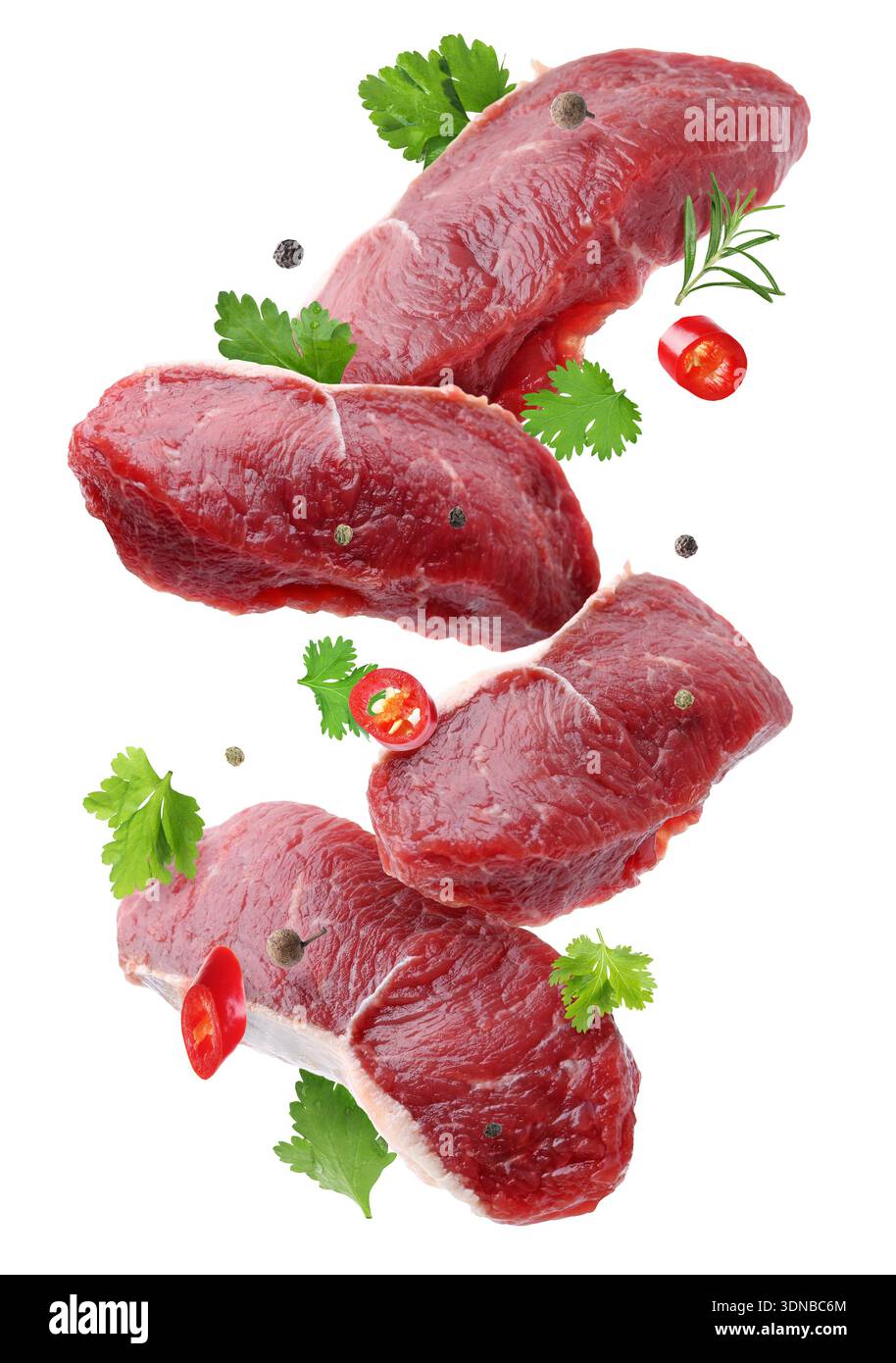 Fresh beef steaks falling on white background Stock Photo