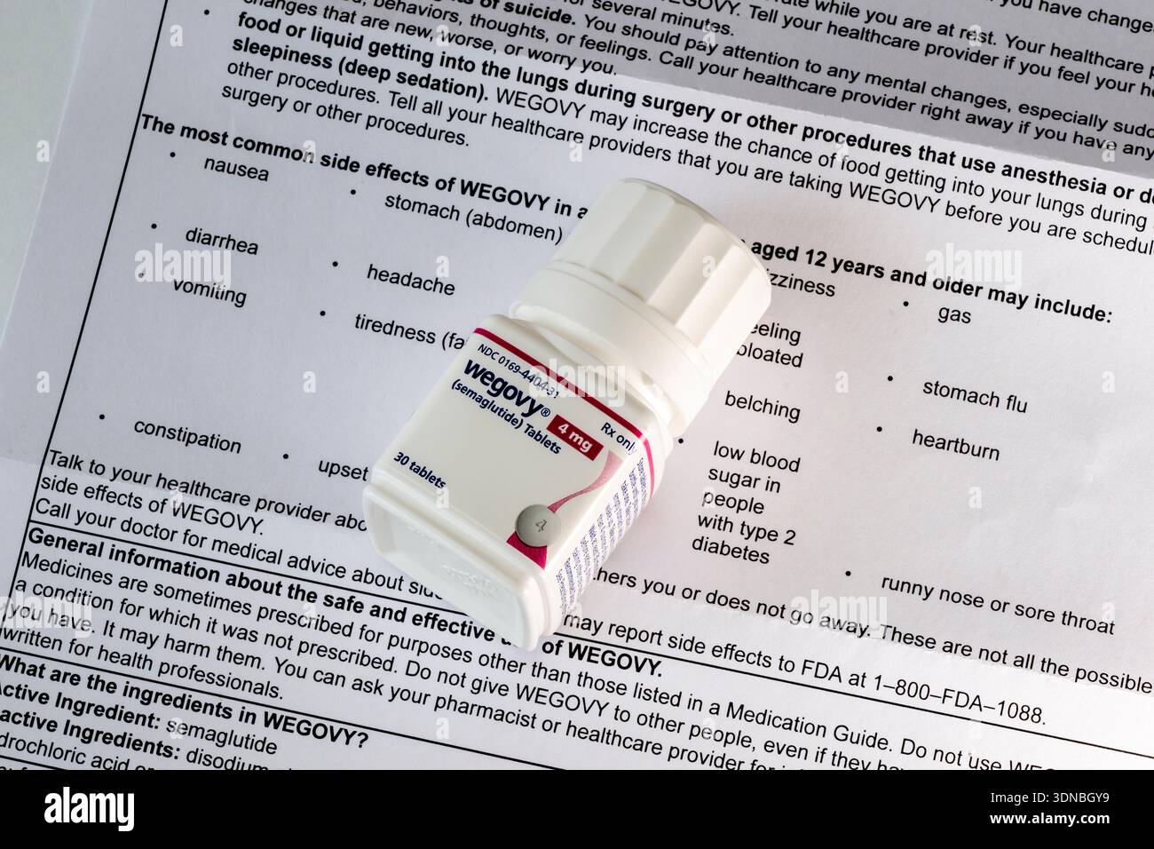 Photo Illustration of the new Wegovy 4 mg bottle of semaglutide tablets on  the sheet showing the side effects of the new pills. Its a prescription med  Stock Photo - Alamy