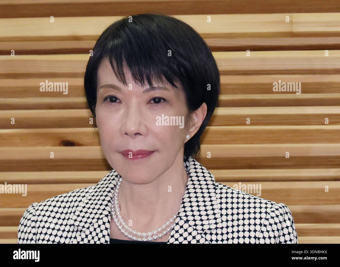 Japanese Prime Minister Sanae Takaichi (C) attends a cabinet meeting at ...