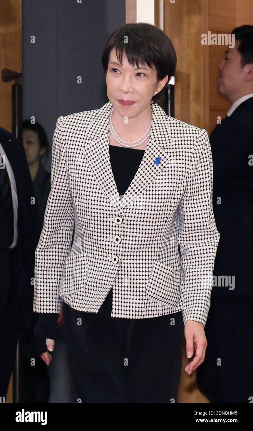 Japanese Prime Minister Sanae Takaichi (C) attends a cabinet meeting at ...