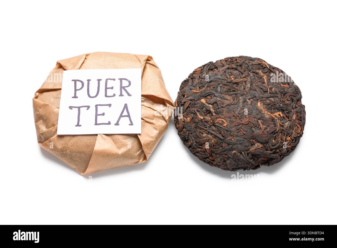 Dry pressed puer tea with sticky note on white background Stock Photo