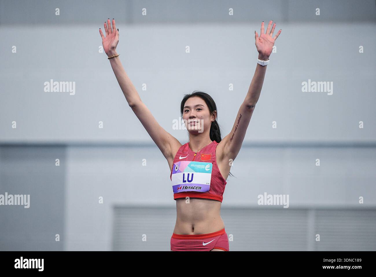 Photo taken on February 8, 2026 shows Chinese athlete Lu Jiawen waving ...