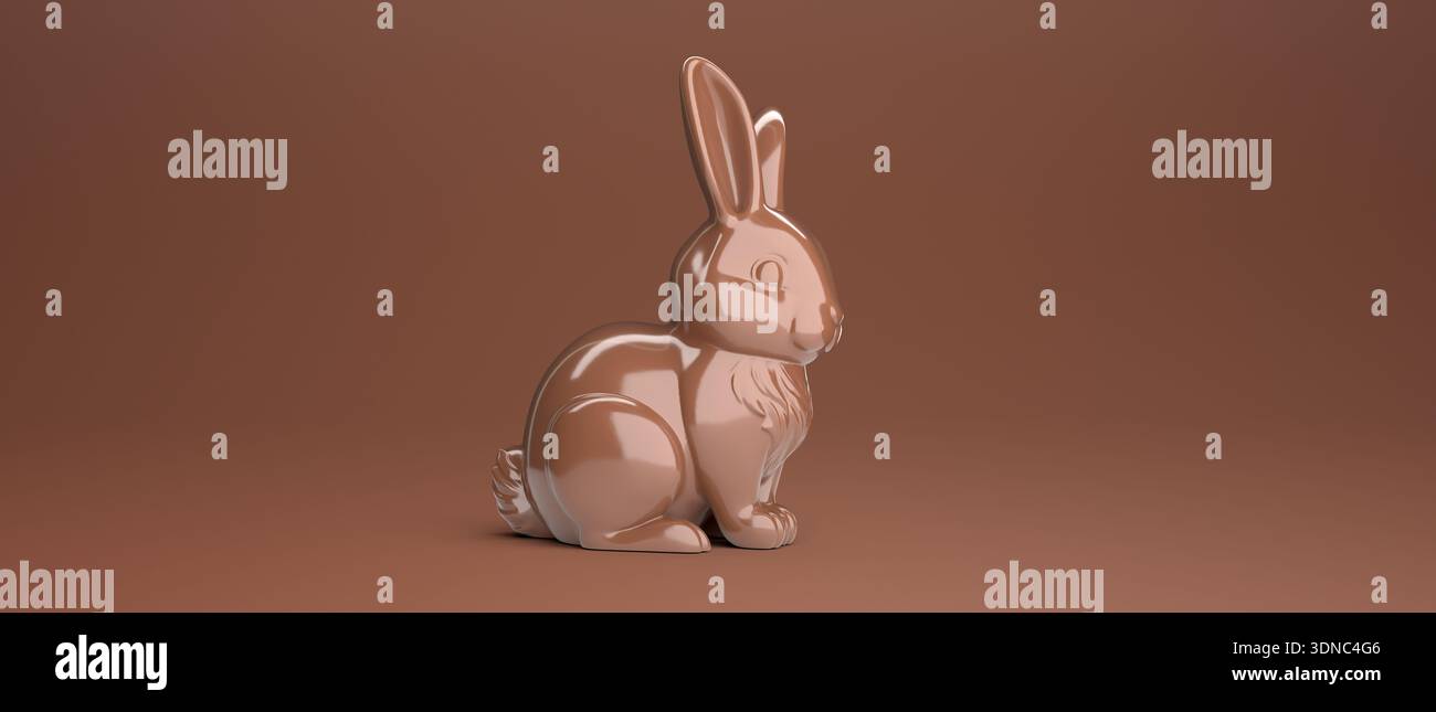 Chocolate Easter bunny on brown background with copy space for text. Stock Photo