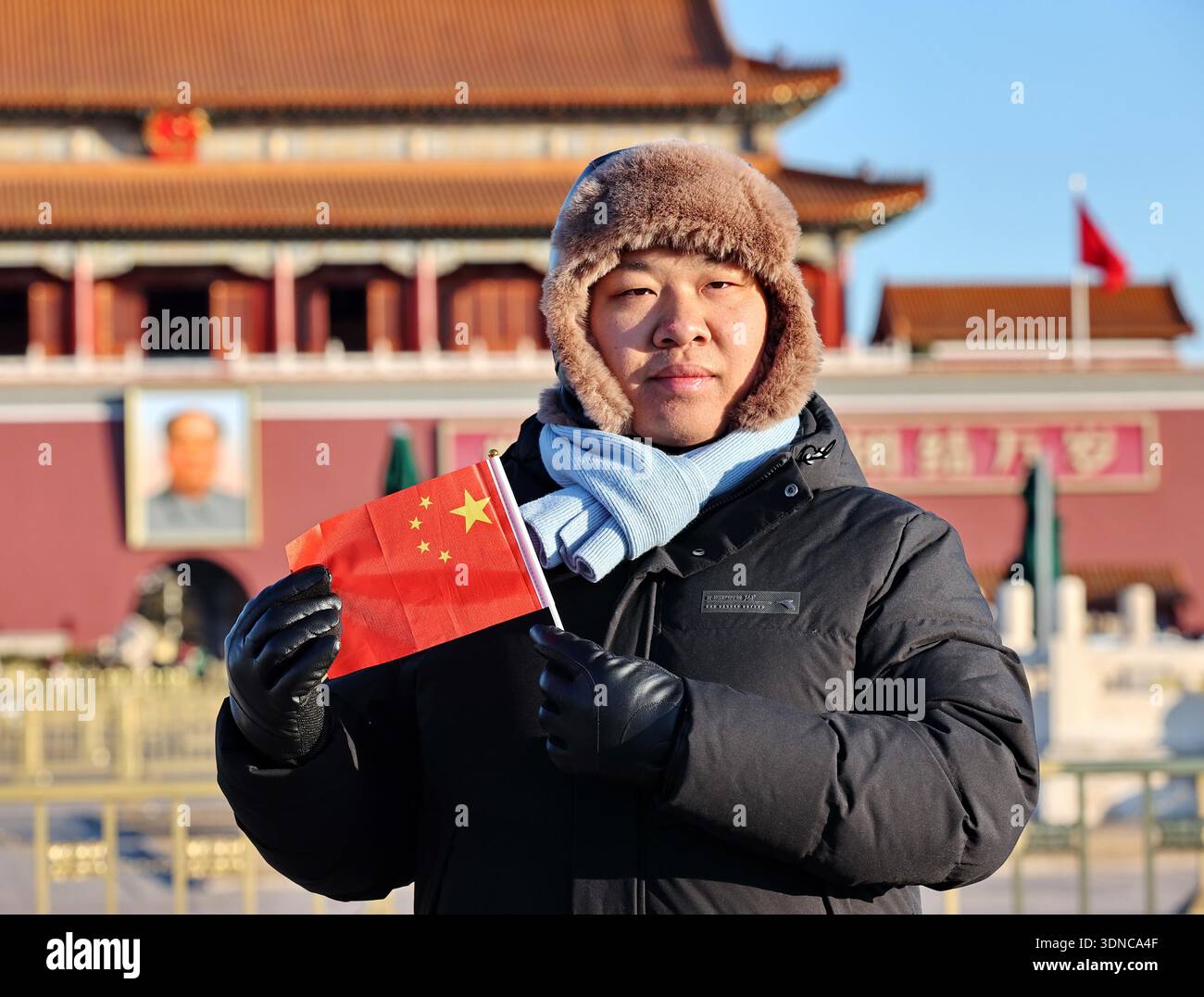 Tourists bundle up against freezing winds while visiting Tiananmen ...