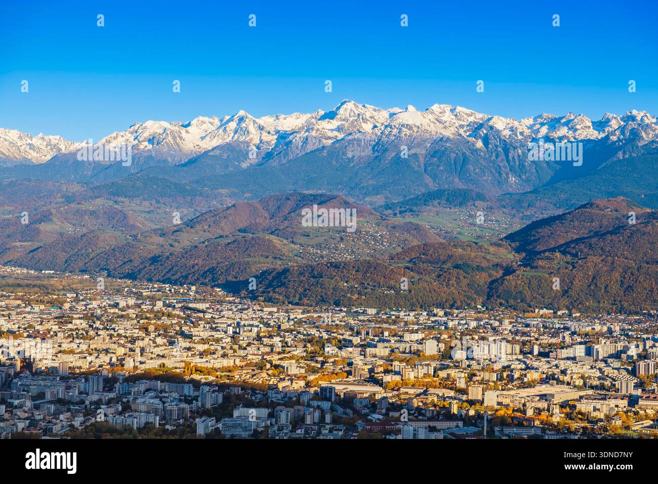 France, Isere, panorama of Grenoble from the foothills of the Vercors massif, the snowy Belledonne massif in the background Stock Photo