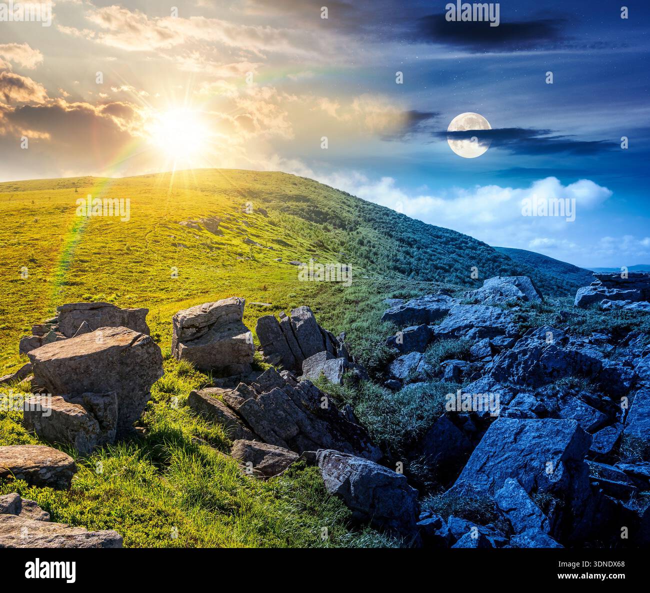mountain landscape on summer solstice. day and night time change concept. green grass and rocks on hillside with sun and moon at twilight. beautiful v Stock Photo